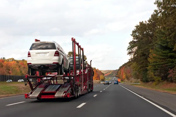 depositphotos_8803851-stock-photo-truck-transporting-cars